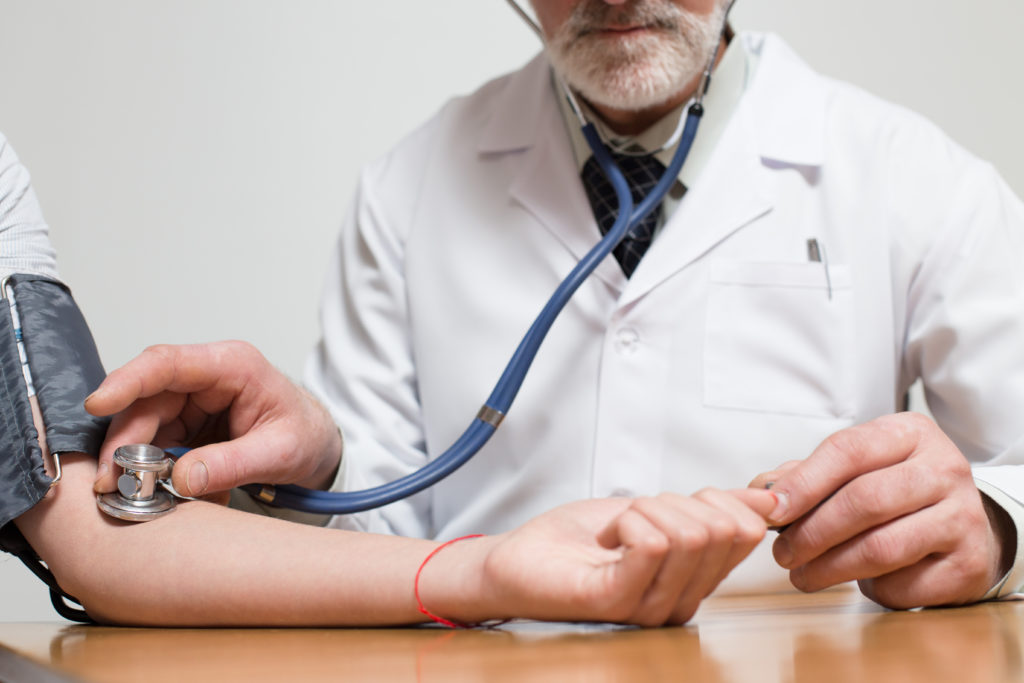 Doctor Checking Blood Pressure
